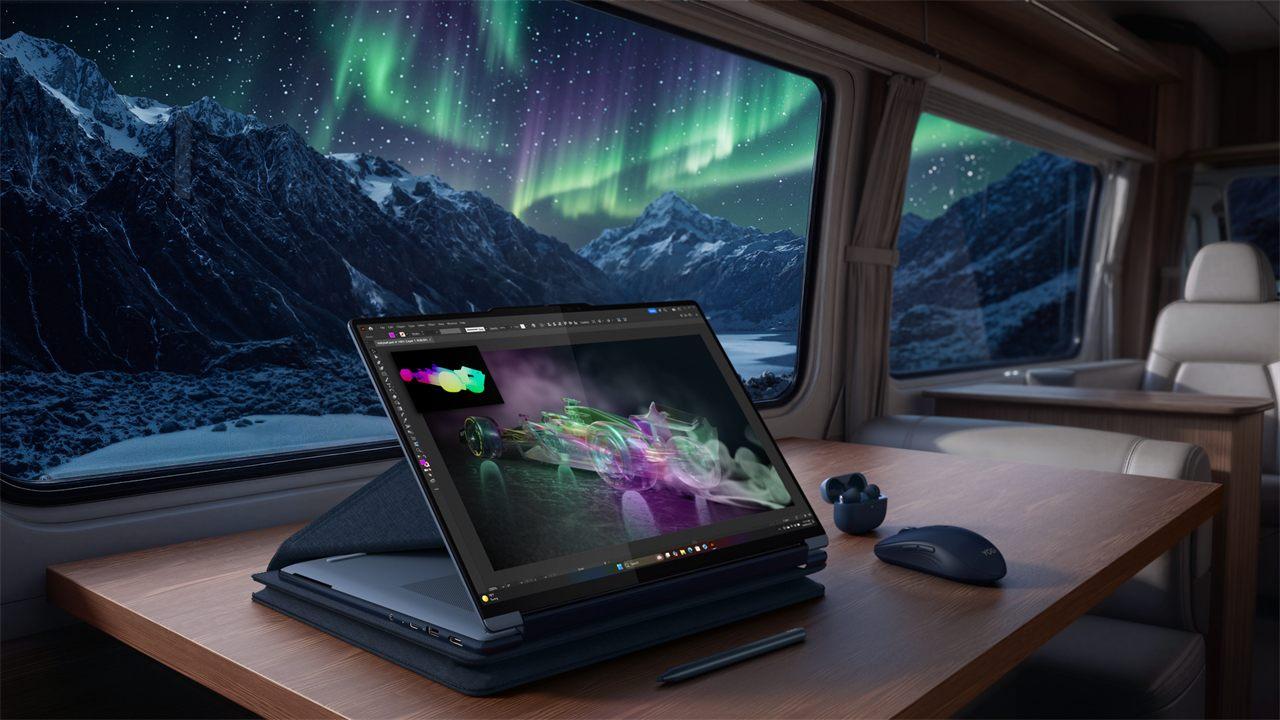Le Lenovo Yoga 9n 2-en-1 en mode chevalet dans un van, face aux aurores boréales