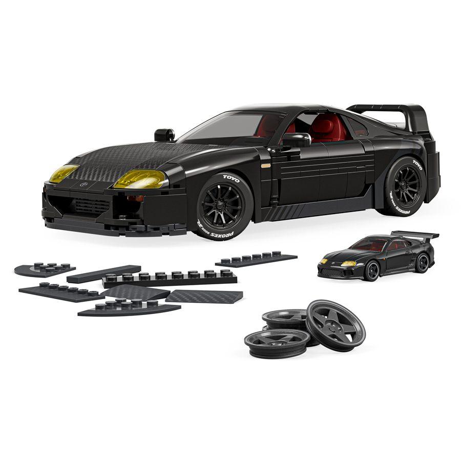 La Toyota Supra MKIV Mattel Brick Shop en noir, avec ses pneus Toyo et sa miniature