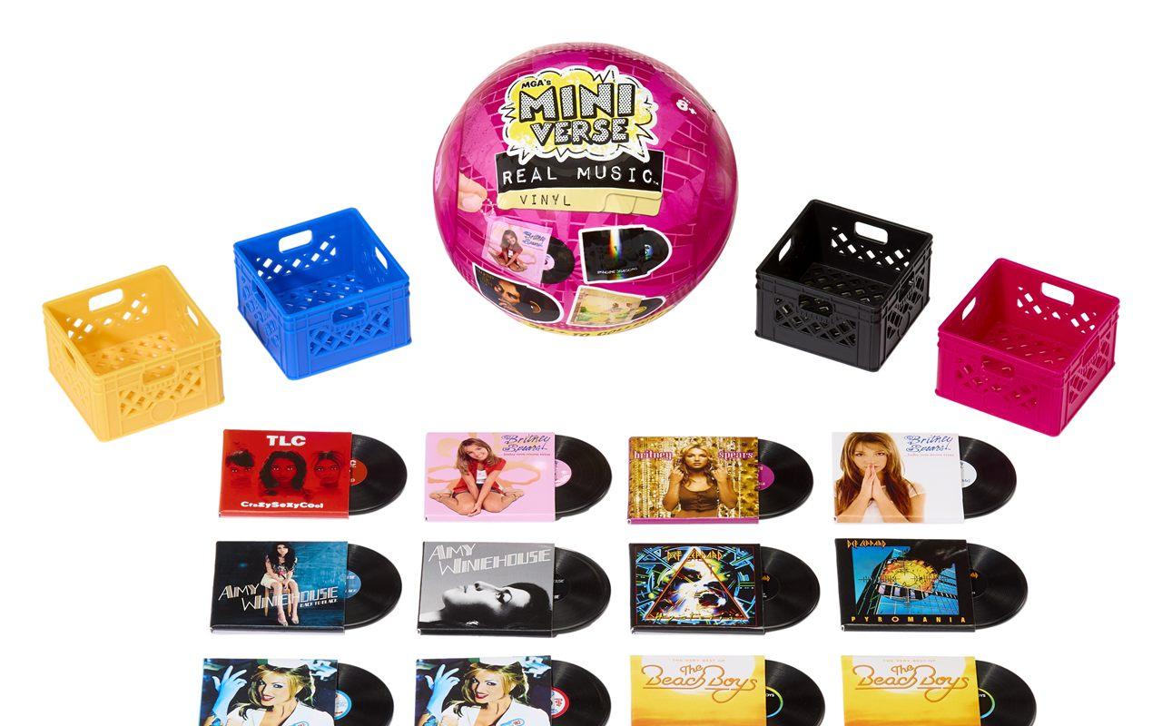 Les quatre bacs ajourés Miniverse Real Music en jaune, bleu, noir et rose, autour d'une boule
