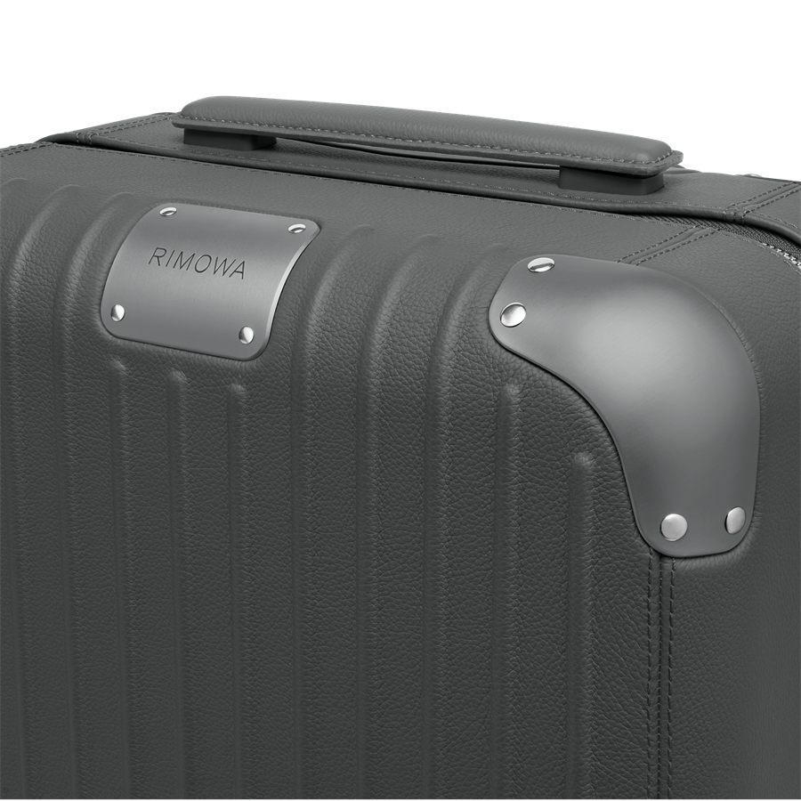 Rivets argentes et tirettes en palladium sur la valise RIMOWA Distinct Cabin Anthracite