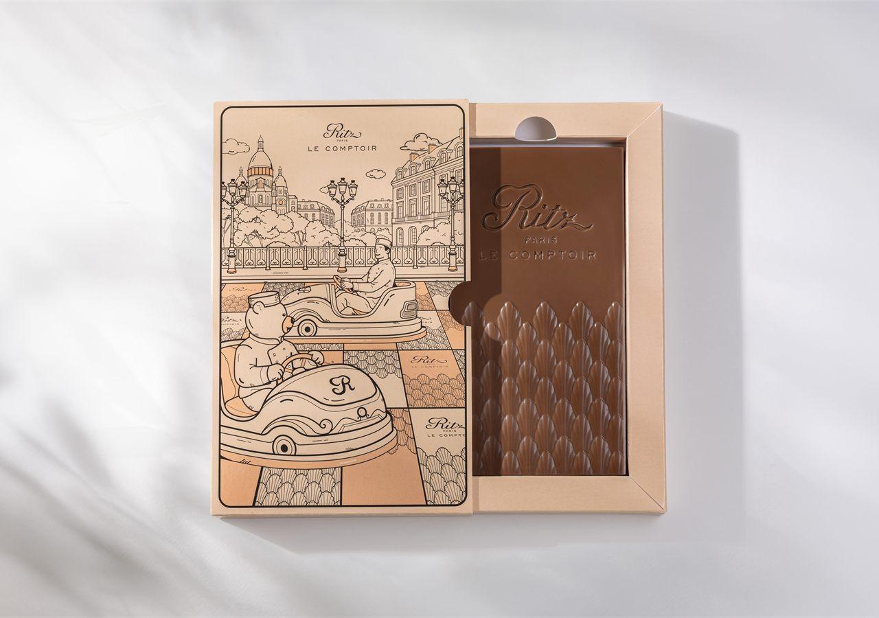 Tablette praliné chocolat au lait Ritz Paris Le Comptoir dans son étui aux autos tamponneuses