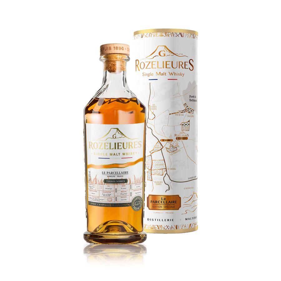 Le whisky Rozelieures Terres Noires et son étui illustré d'une carte