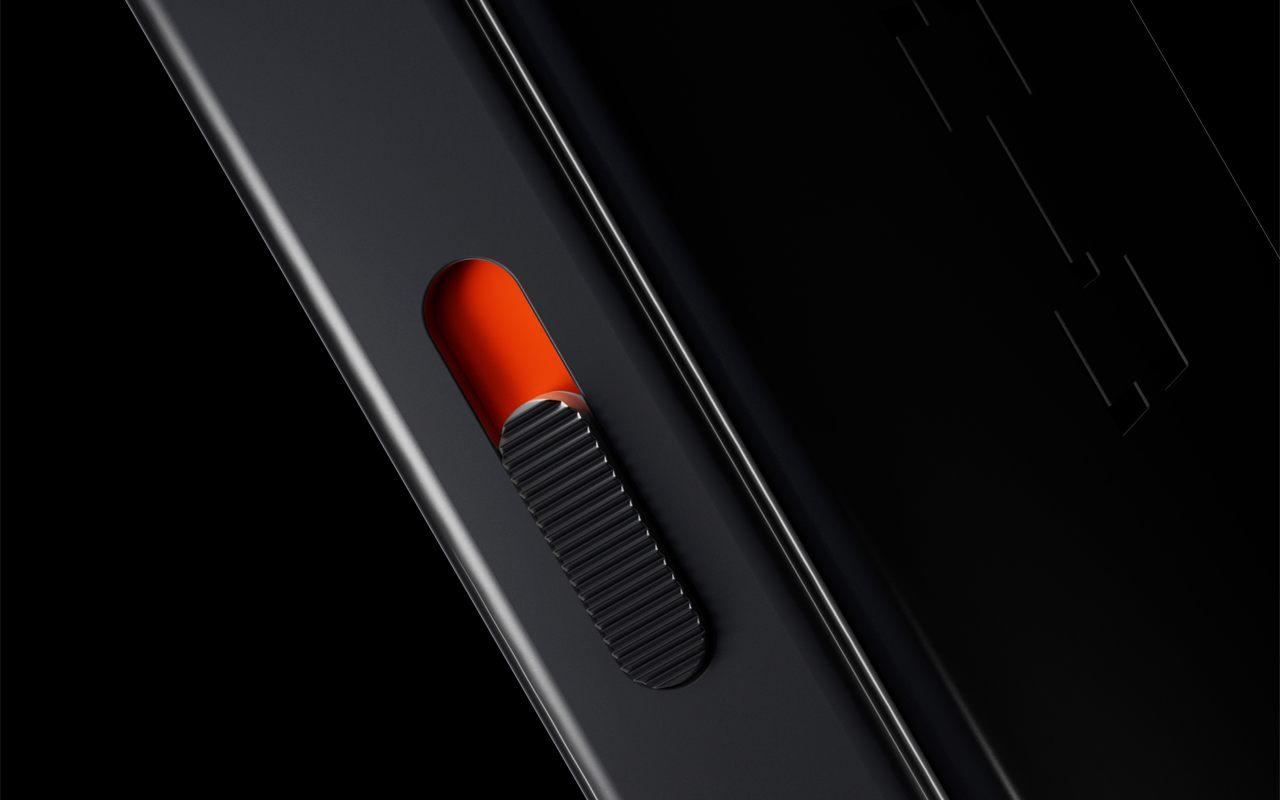 Gros plan sur l'interrupteur de confidentialité orange du Ledger Atom