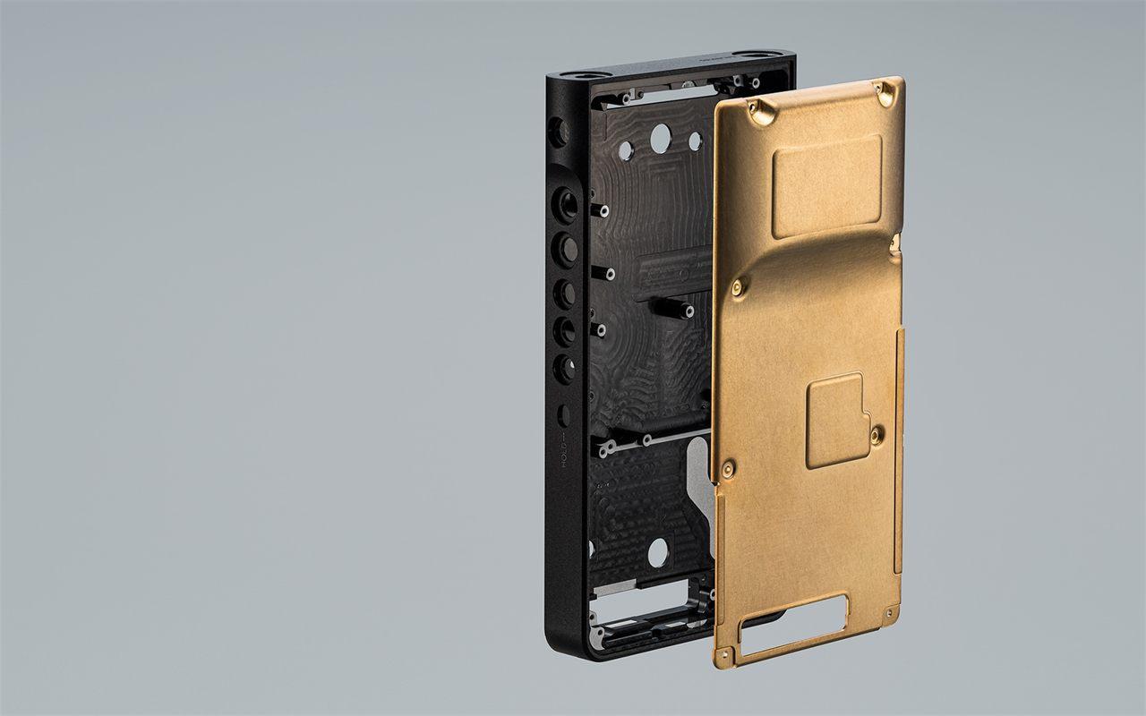 Vue éclatée du Walkman NW-WM1AM3, structure en aluminium et châssis arrière en cuivre plaqué or